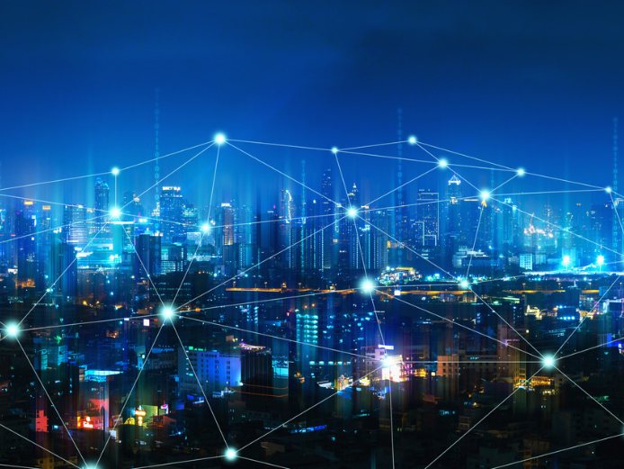 A connected global city at night, representing Manelith Global's cross-border reach